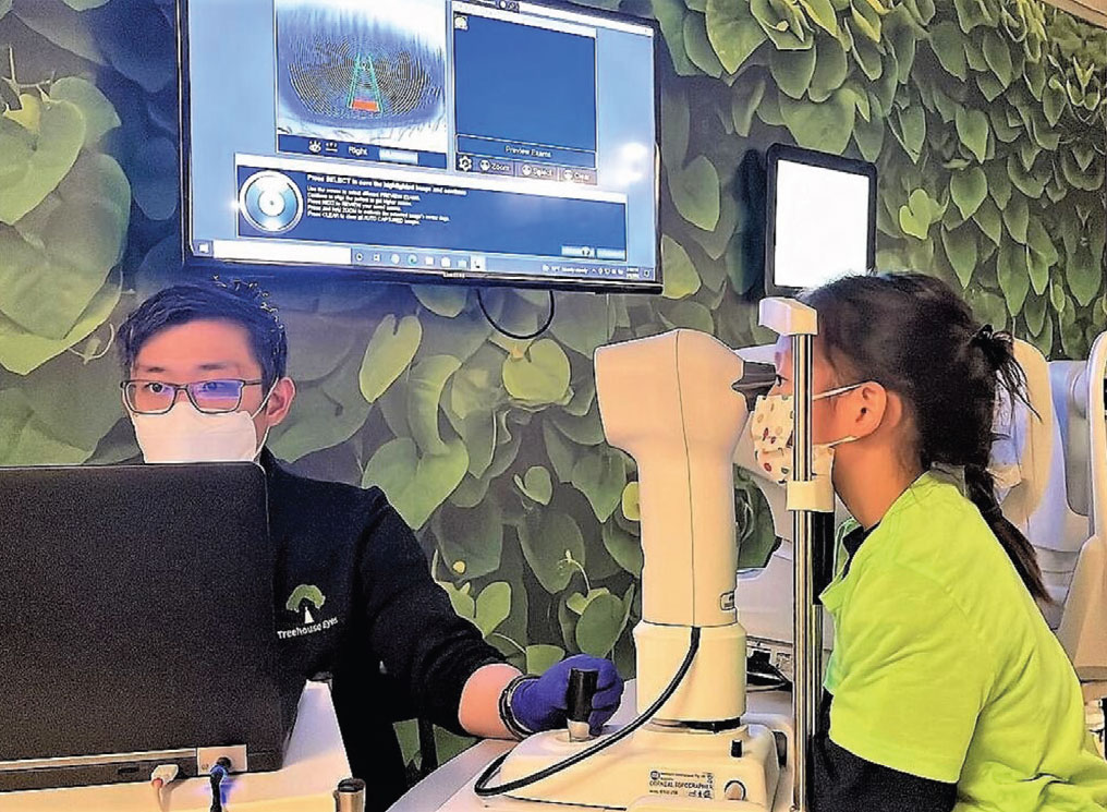 This child is having a corneal topography scan performed at an interim follow-up visit.